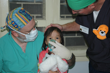 Dr. Fleming with young Vietnamese patient © UC Regents